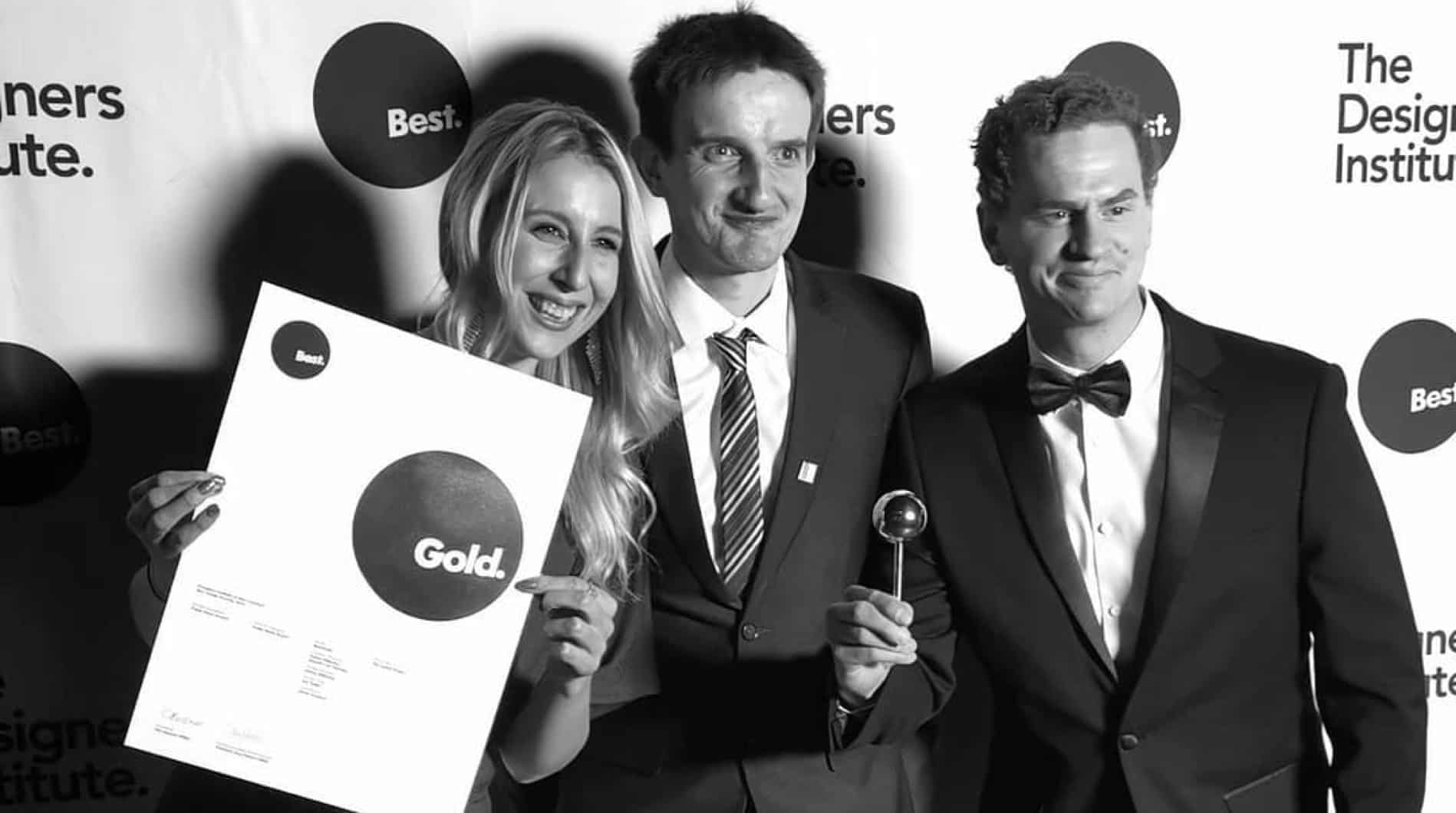 Members of The Quentosity Group receiving a Gold design award.