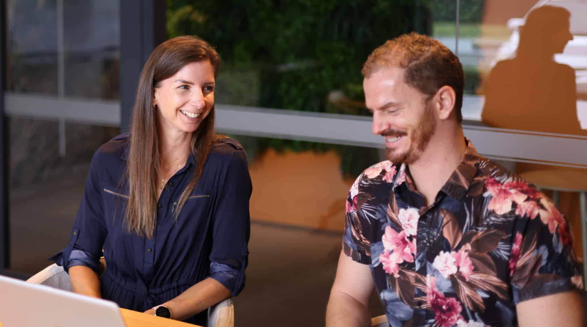 Two Quentosity team members strategising in the board room.